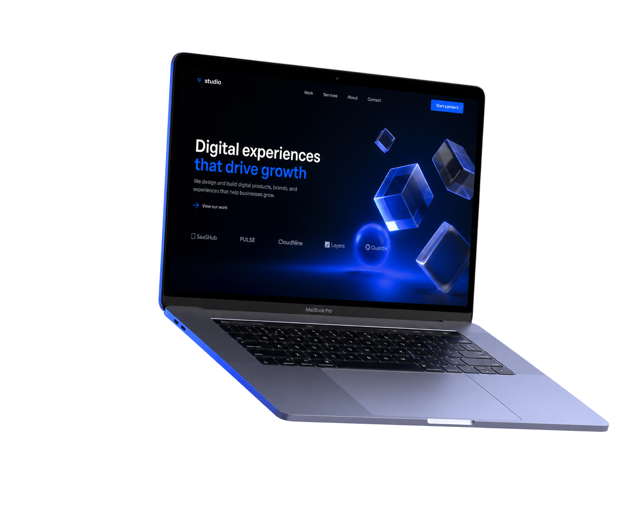 Floating MacBook Pro displaying the JetAni homepage surrounded by glass objects